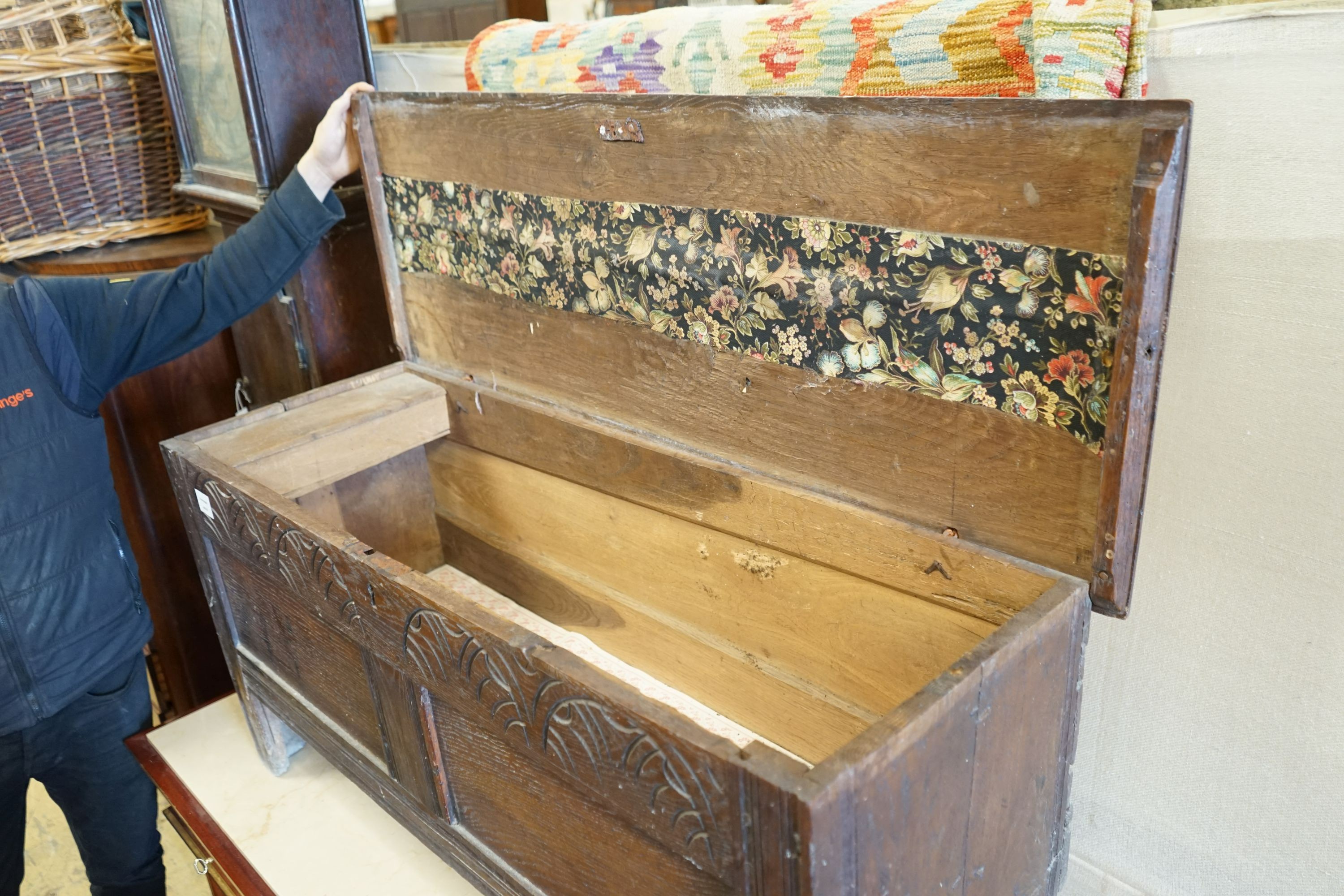 A 17th century and later carved oak six plank coffer, length 117cm, depth 43cm, height 56cm